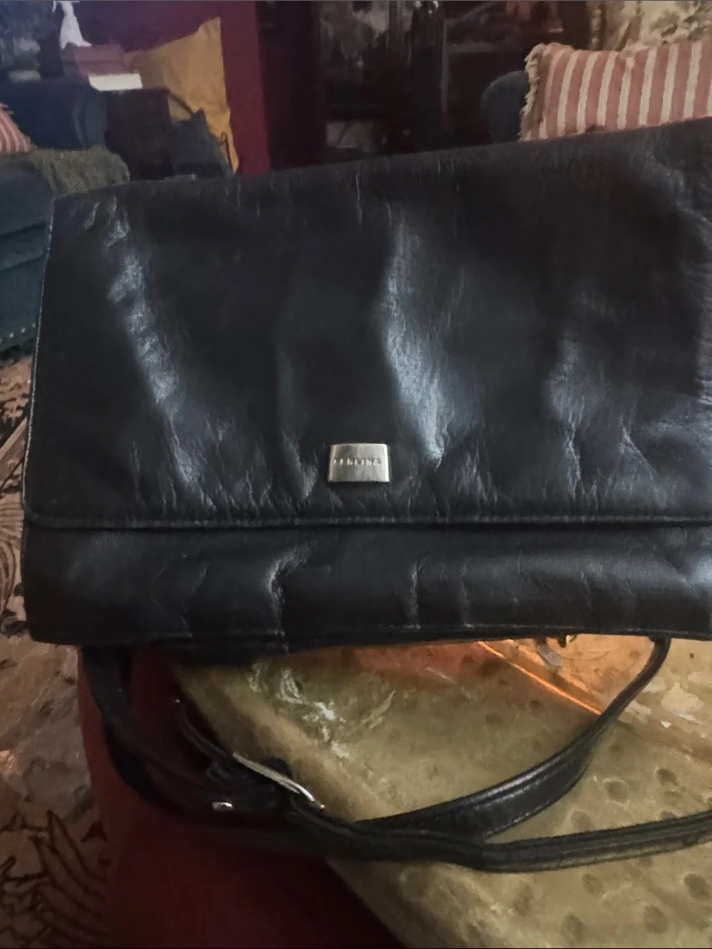 Perlina Black Leather Fold-Over Crossbody with Metal Plaque